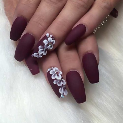 burgundy nails with flower motiff